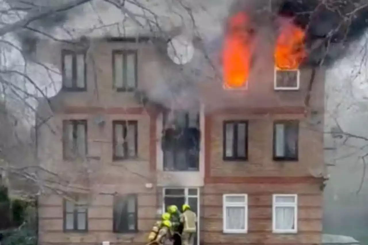 Man killed in huge blaze at block of flats as residents ‘jump from windows’