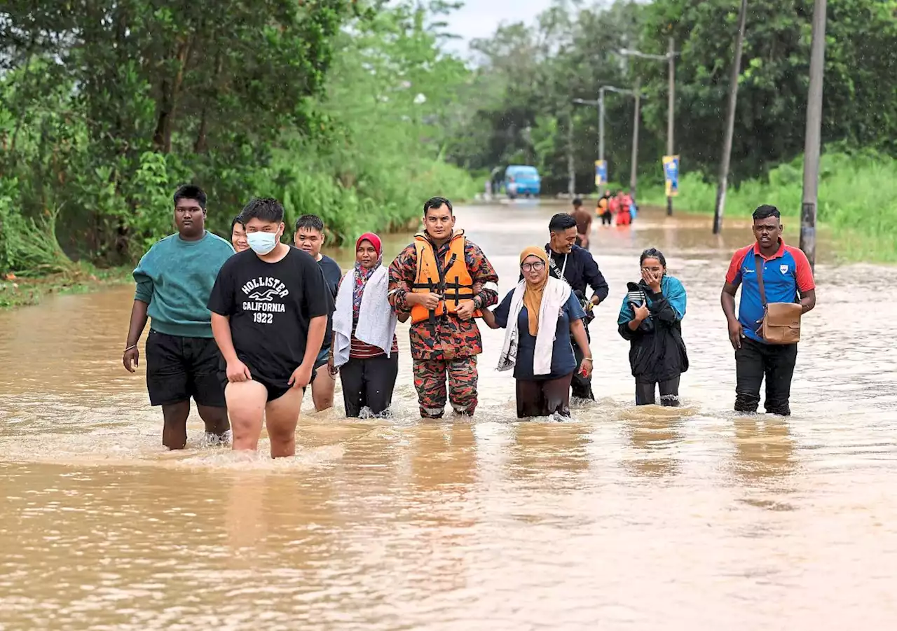 Rescuers in same boat as their homes flooded too