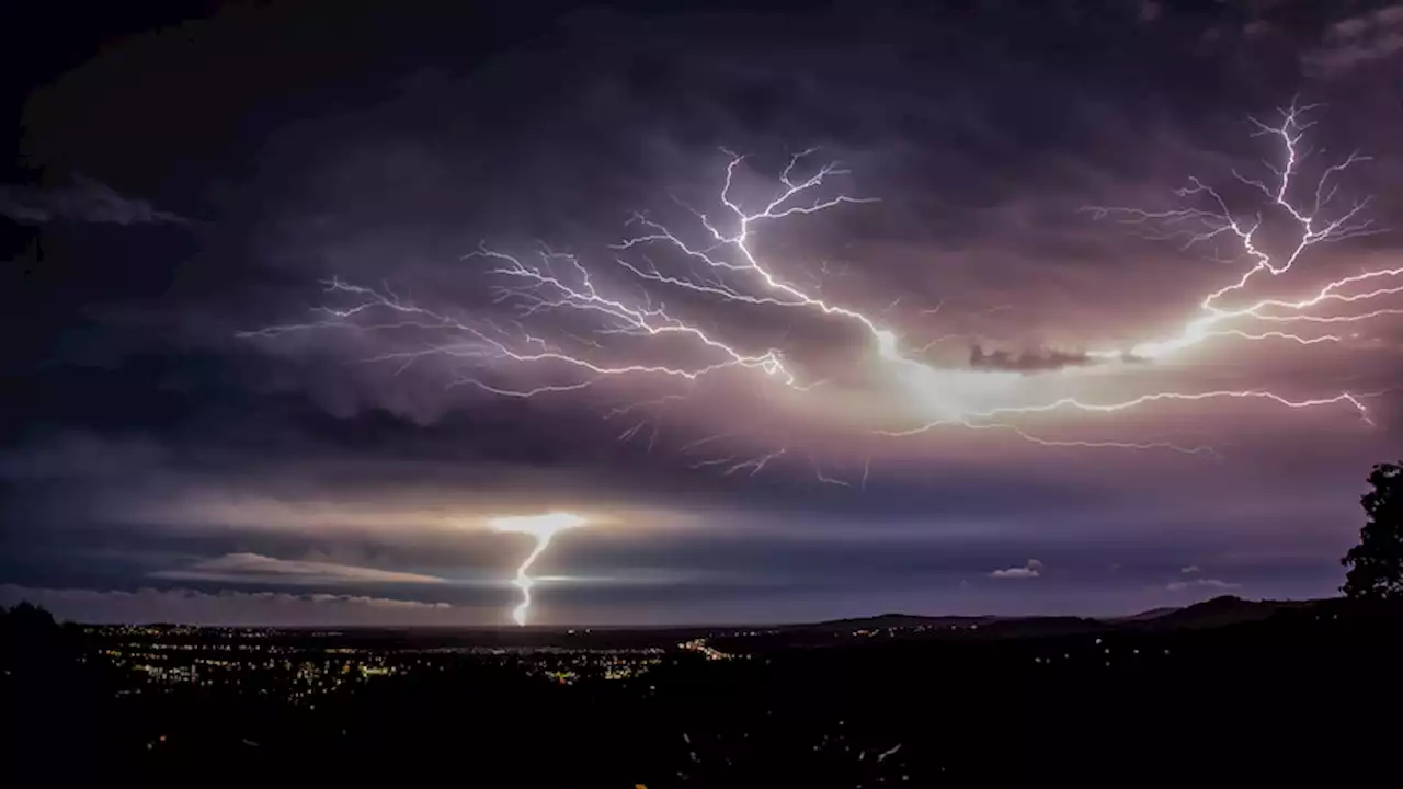 Large hail recorded, yacht hit by lightning as Good Friday storms sweep Queensland