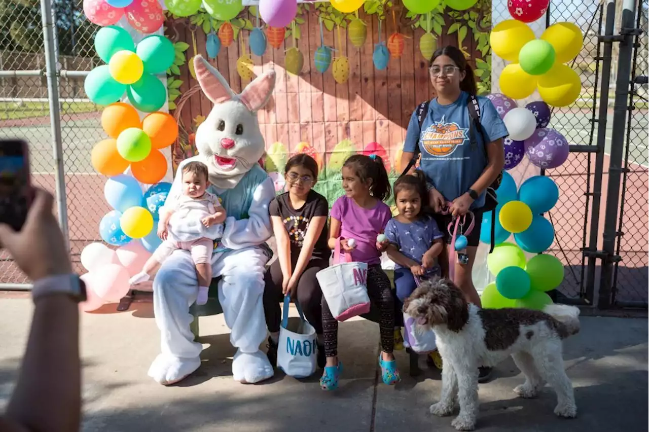 Children laugh and color eggs at Easter egg hunt event in Pacoima