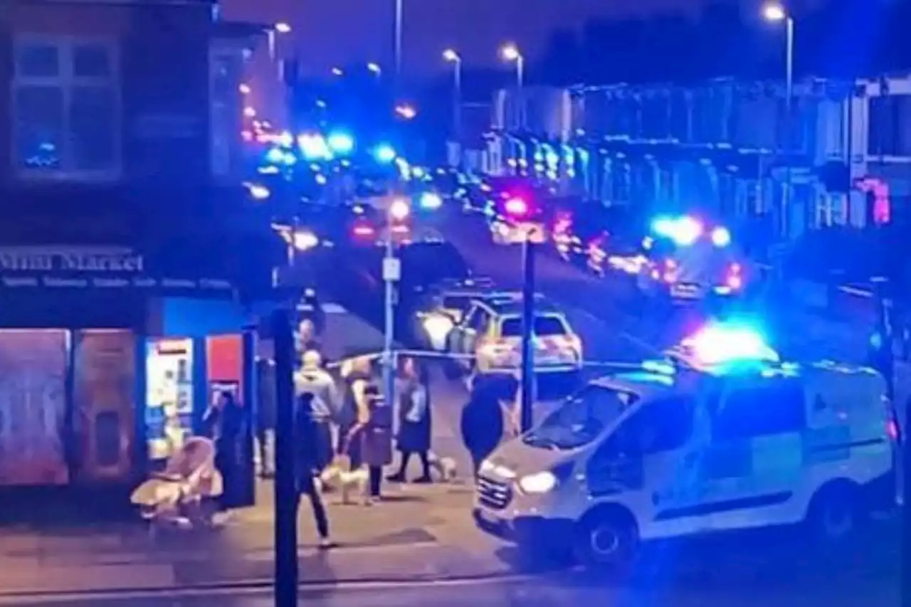 Woman fighting for life after Good Friday 'stabbing' as armed cops storm street