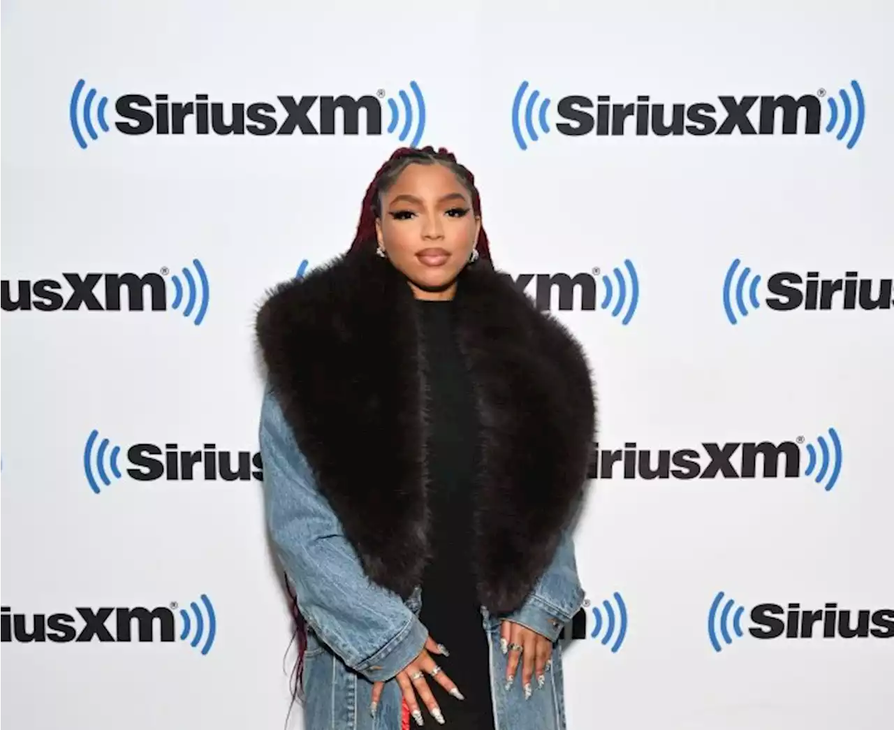 Chloe Bailey Embraces Drama in Denim Coat With Statment Fur Trim at SiriusXM Studios