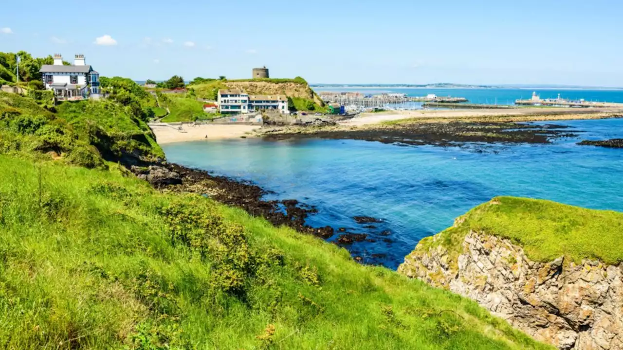 Seaside town with secret beaches, cliff walk & castle minutes from Irish city