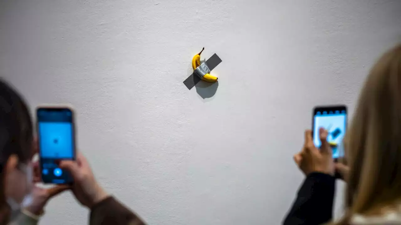 'Hungry' South Korean student takes banana from Maurizio Cattelan's art installation from wall and eats it