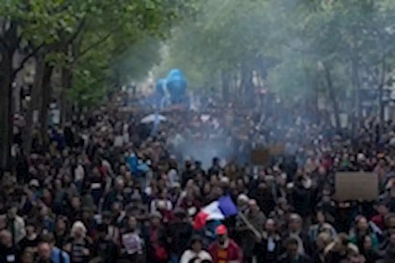 Hundreds of thousands of French protest Macron’s pension law on May Day