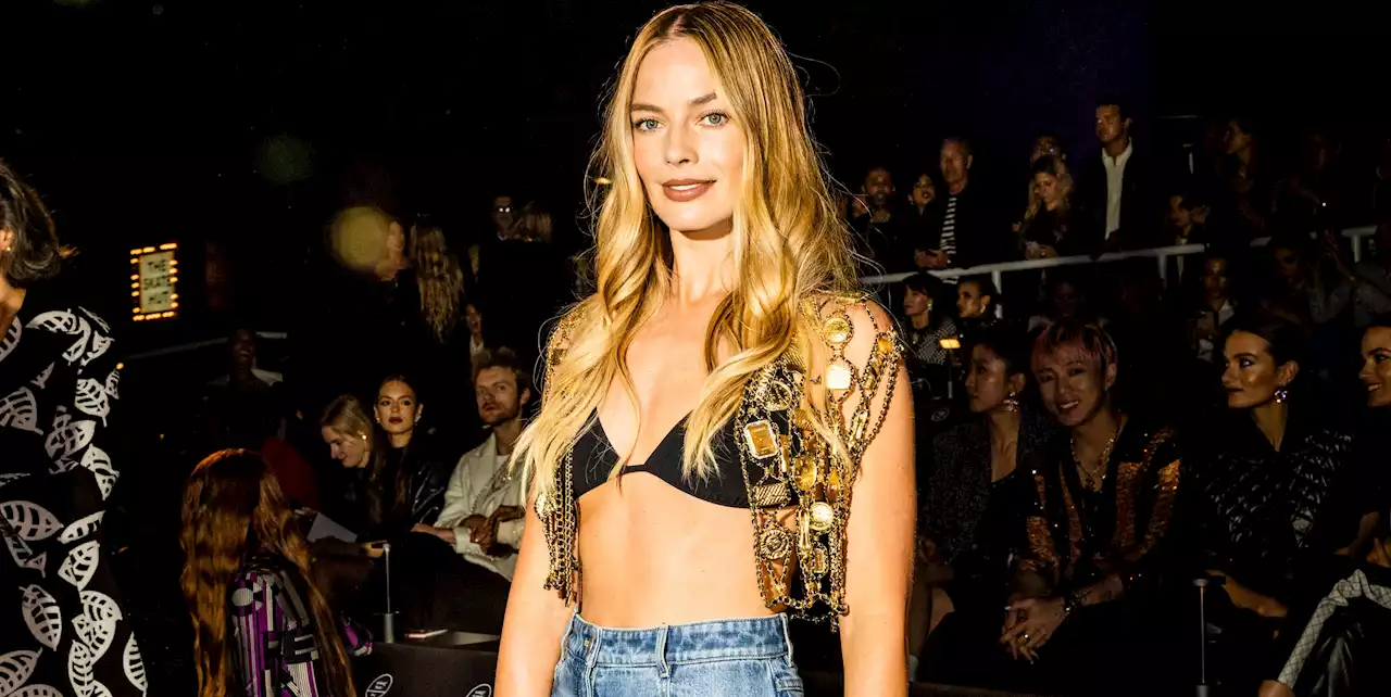 Margot Robbie Pairs Nothing But a Bra and Chain-Link Vest With Her Bell-Bottom Jeans