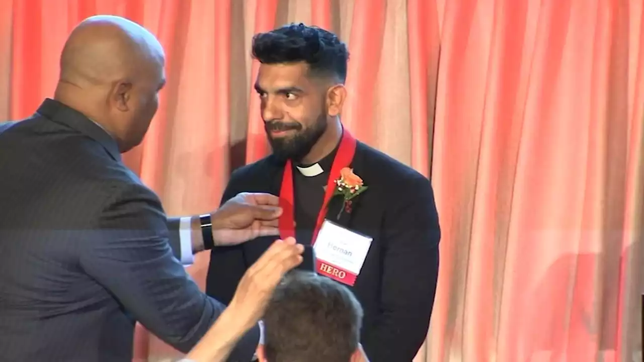 Priest honored for helping strangers to safety as they fled Highland Park parade shooter