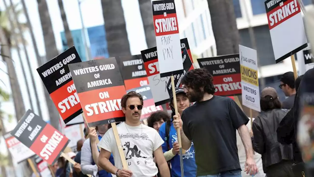 With writers' strike underway, film and TV studios start labor talks with directors | CNN Business