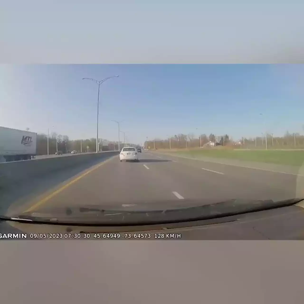 Dashcam films terrifying moment 'speeding' car's hood flies up on highway