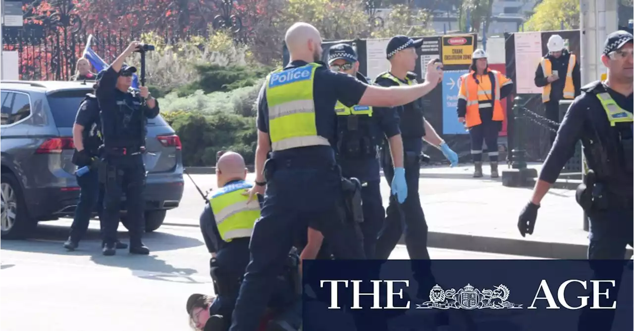 Two arrested as neo-Nazi group clashes with police at Victorian Parliament