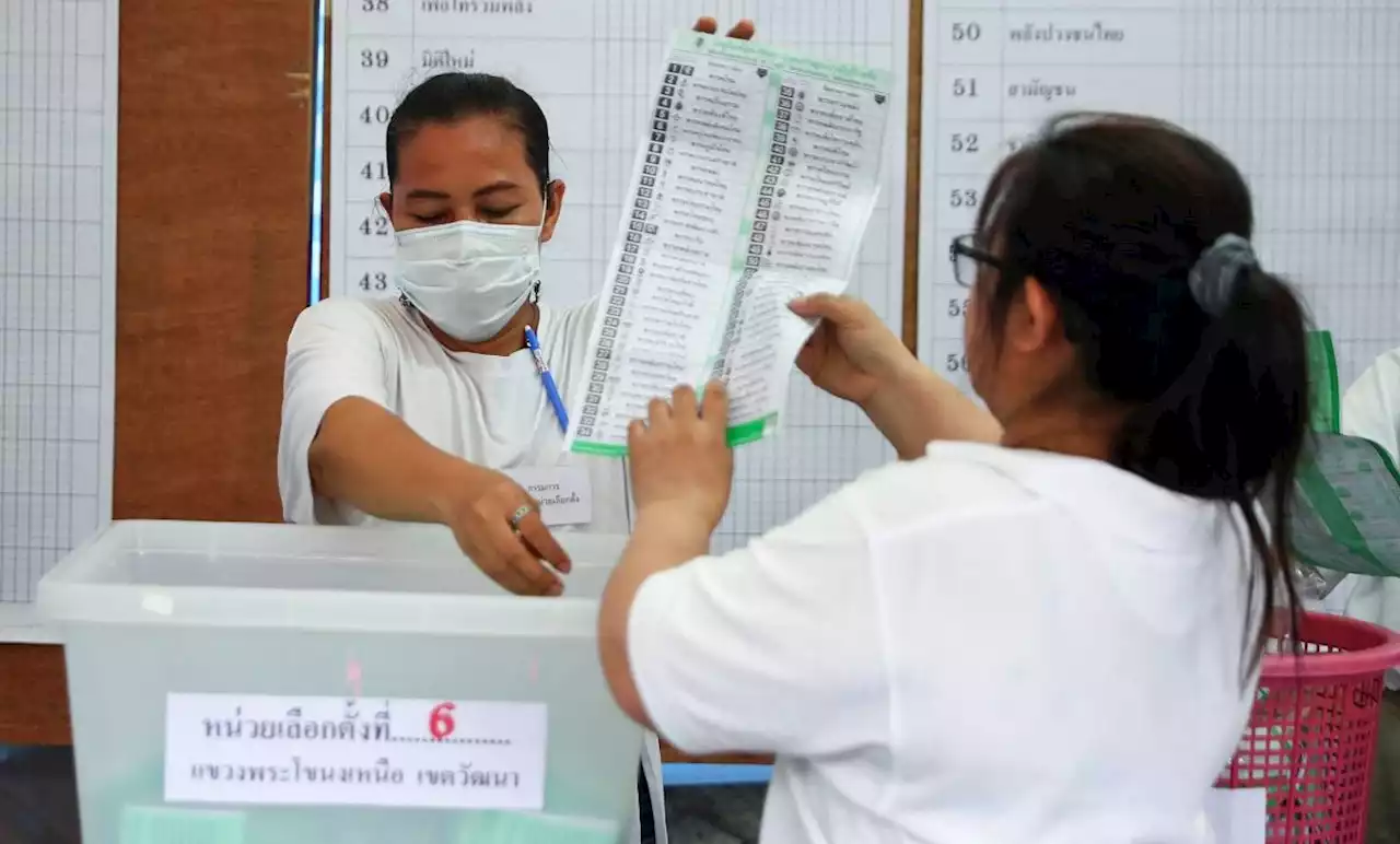 Record turnout projected as Thais vote in battle of old rivals