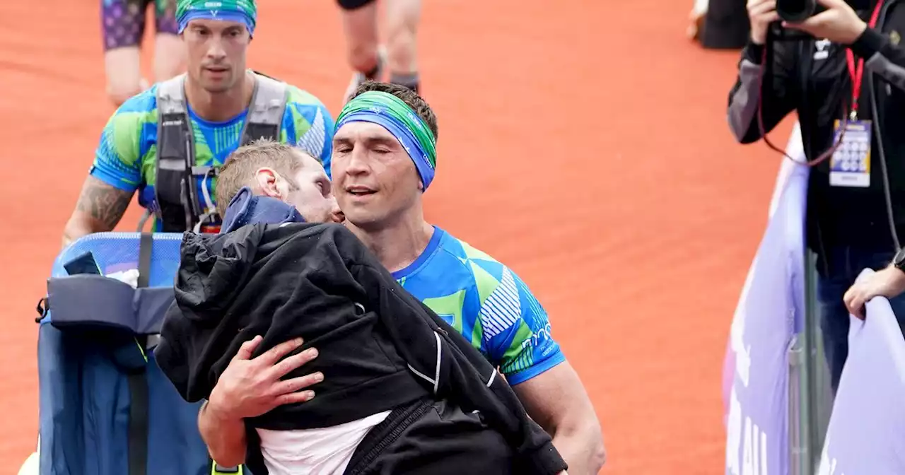 Watch the amazing moment Kevin Sinfield carries Rob Burrow over finishing line