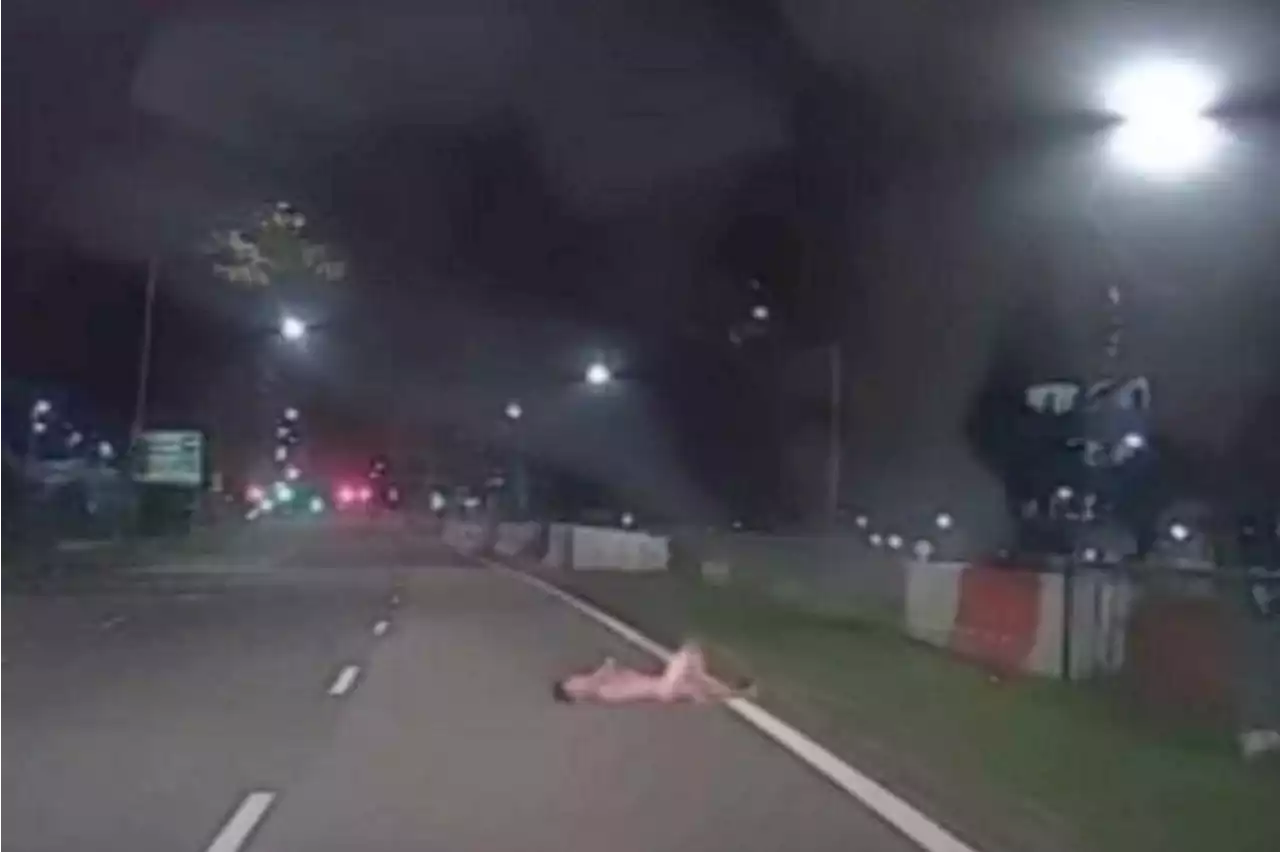 Man arrested after video shows him naked, lying on road in Sembawang