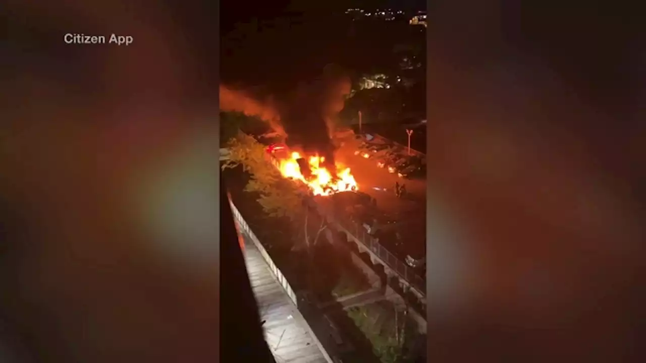 Explosive fire engulfs roof of parking garage in East New York, multiple cars damaged