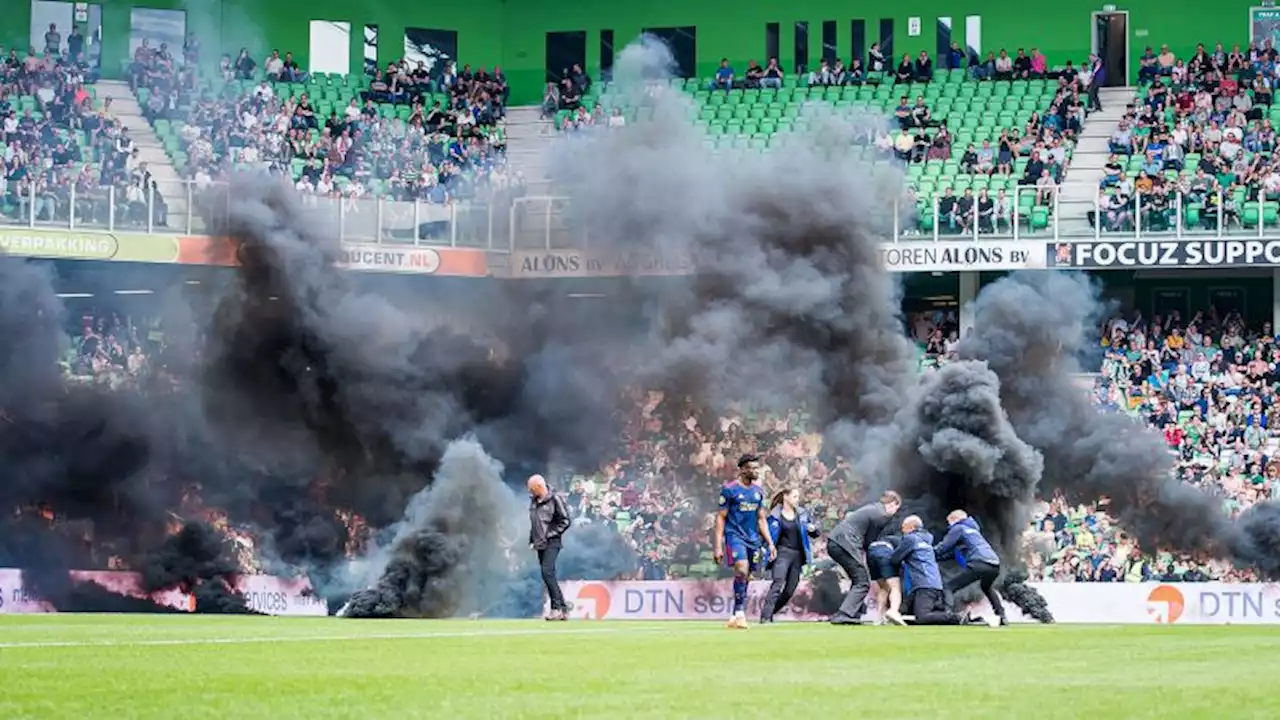 Top-flight Dutch soccer match suspended due to fans throwing fireworks onto the pitch | CNN