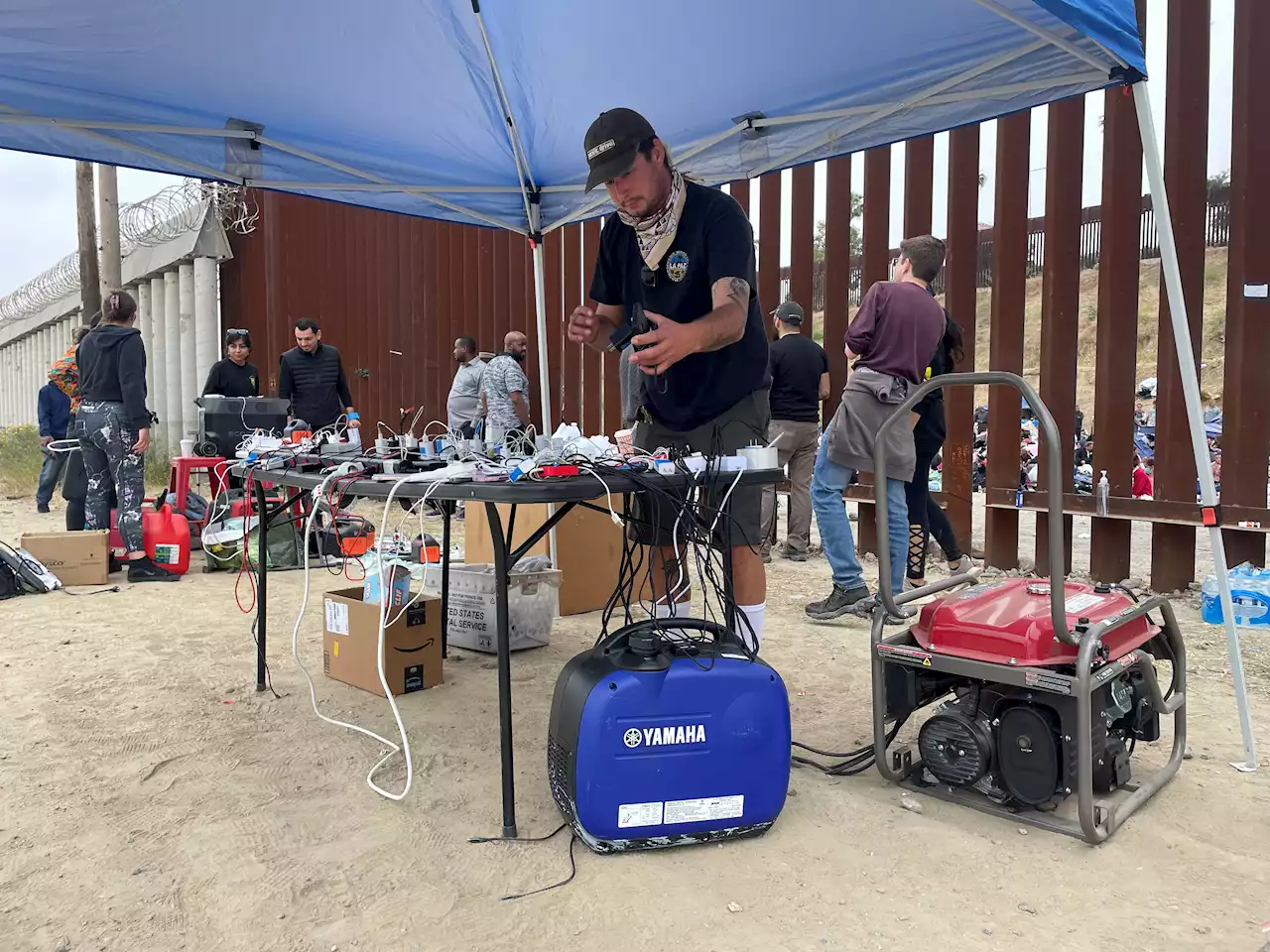 San Diego Volunteers Create Phone-Charging Station for Migrants at US—Mexico Border