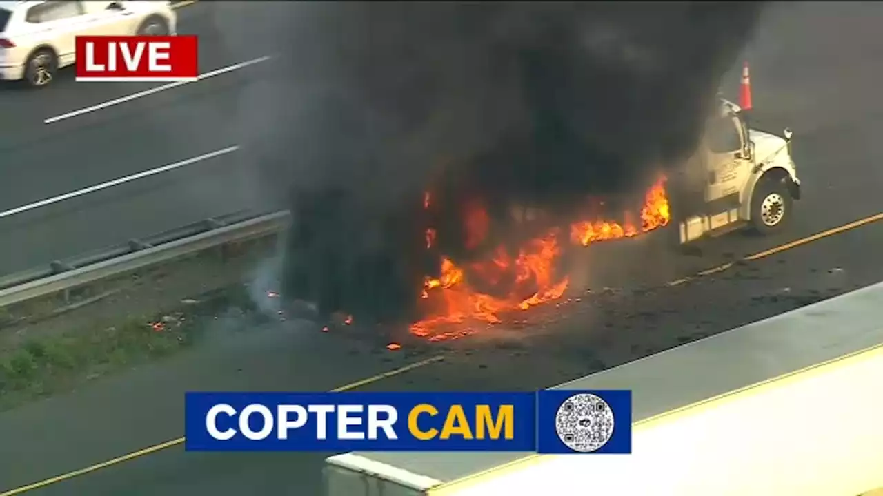 Firefighters put out flames engulfing box truck on NJ Turnpike near exit for Route 46