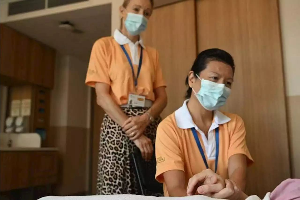 Holding the hand of a dying stranger