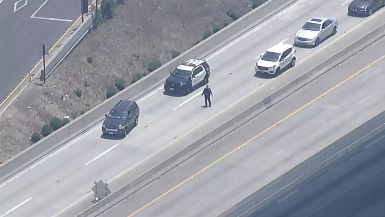 Shooter opens fire on LAPD officers on 110 Freeway in South Los Angeles, police say