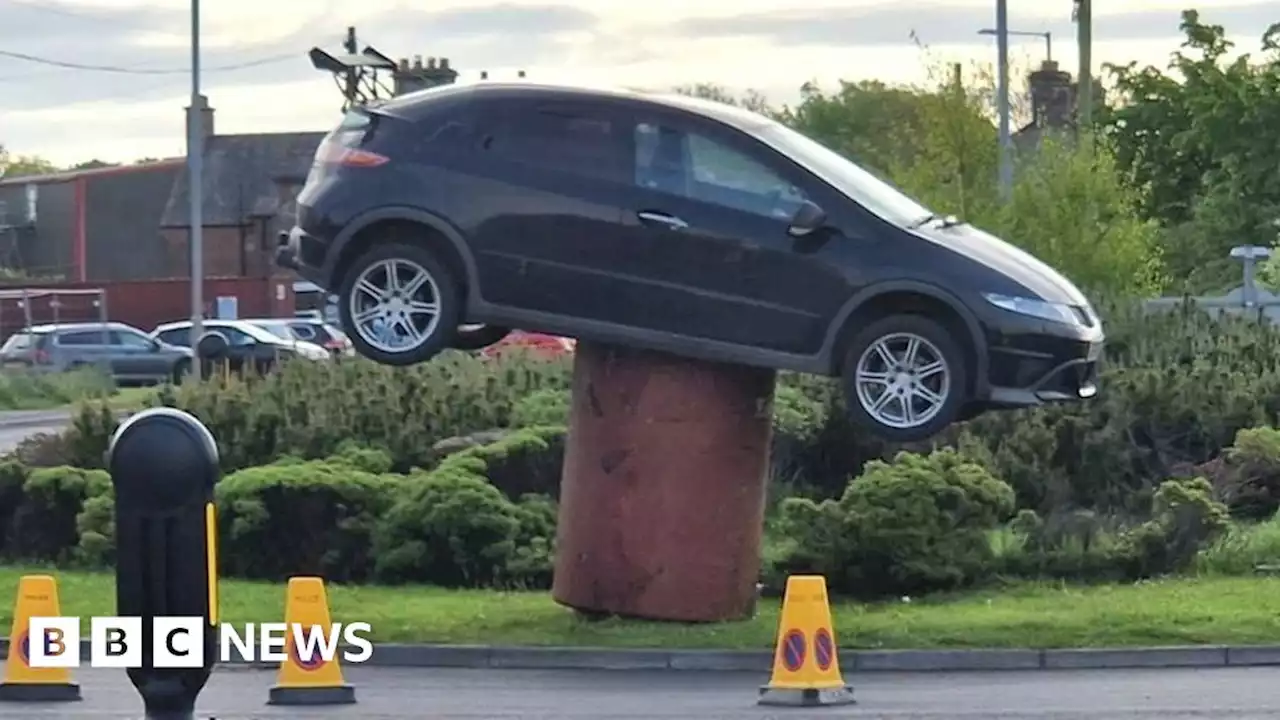 Stolen car found on top of metal drum at roundabout in Annan