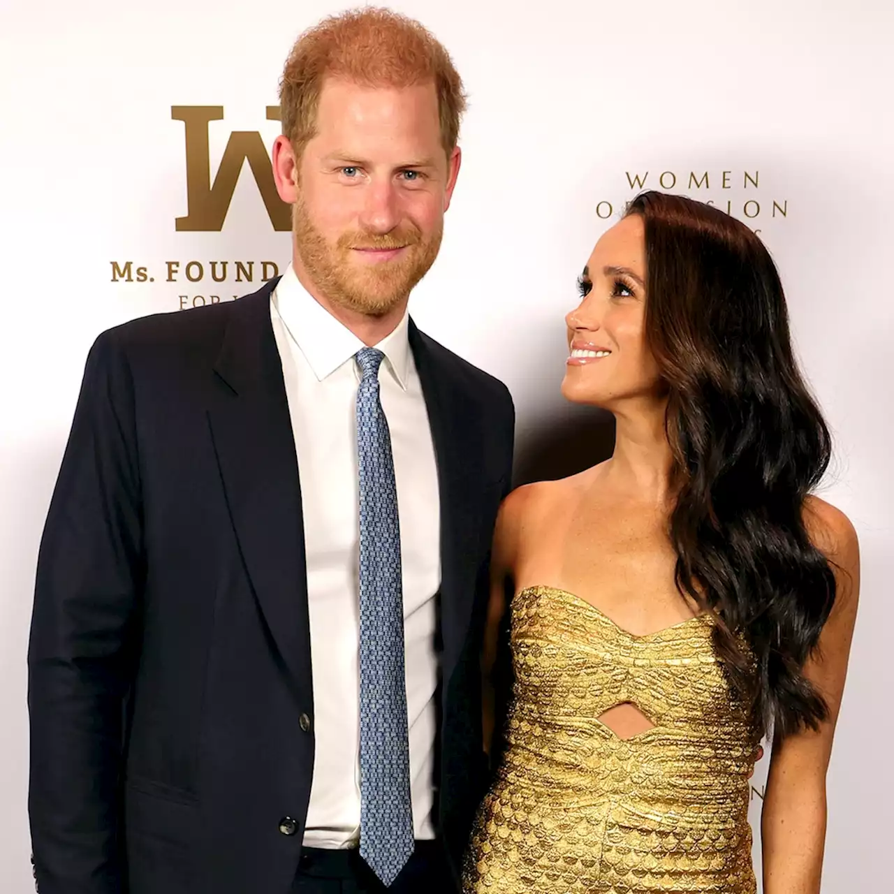 Meghan Markle Is Glittering in Gold During Red Carpet Date Night With Prince Harry After Coronation - E! Online