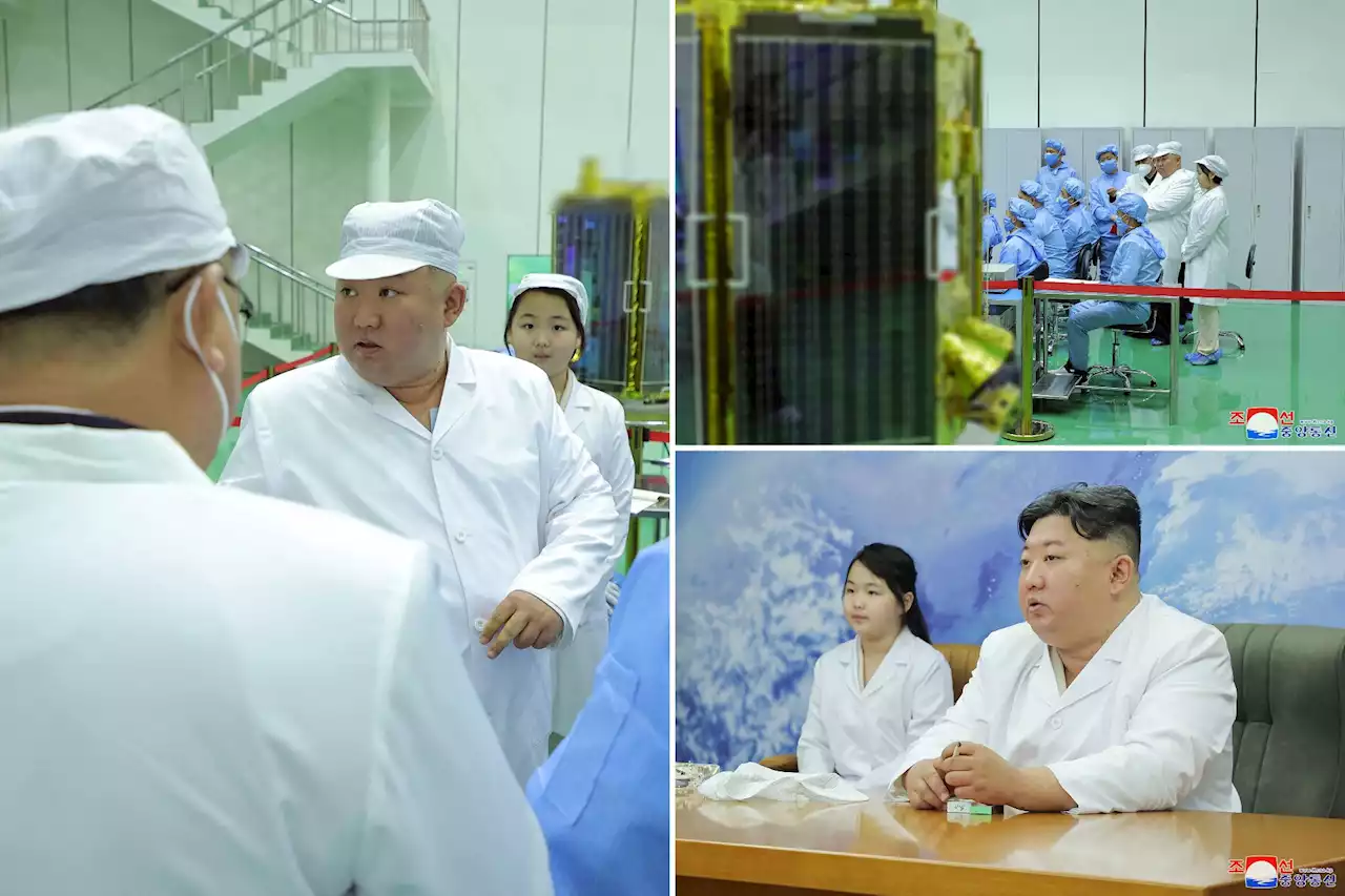 North Korea shows Kim Jong Un examining a military spy satellite that may be launched soon