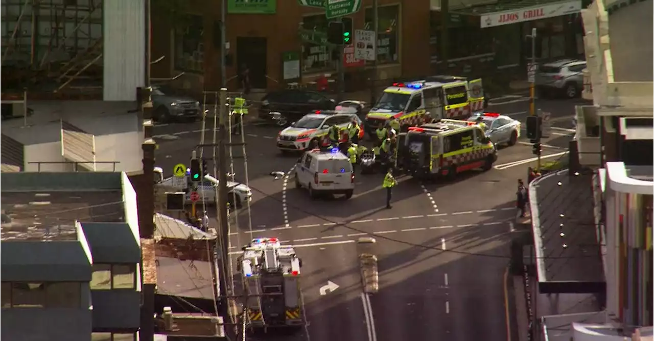 Man arrested after three children knocked down by car in Sydney's north