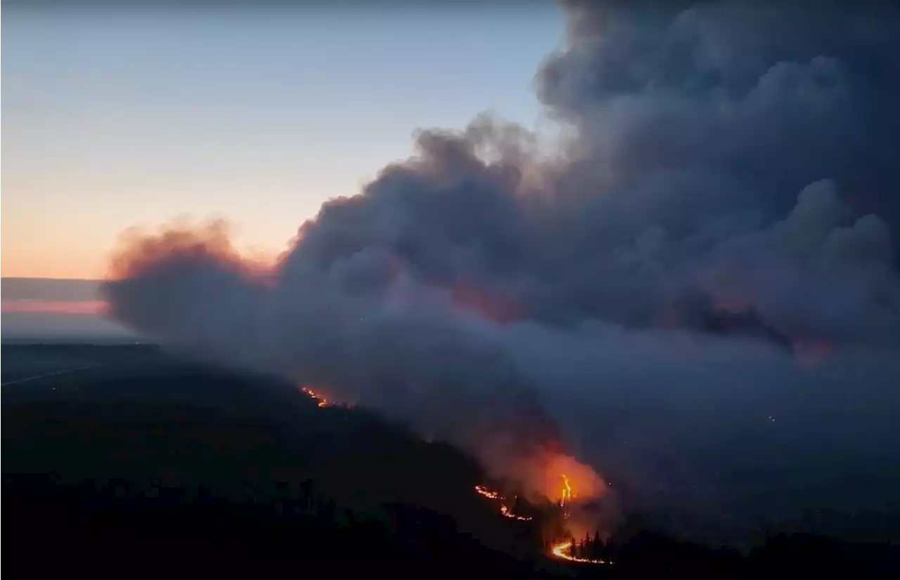 Helicopters and layer of smoke help in fight against northeastern B.C. wildfire