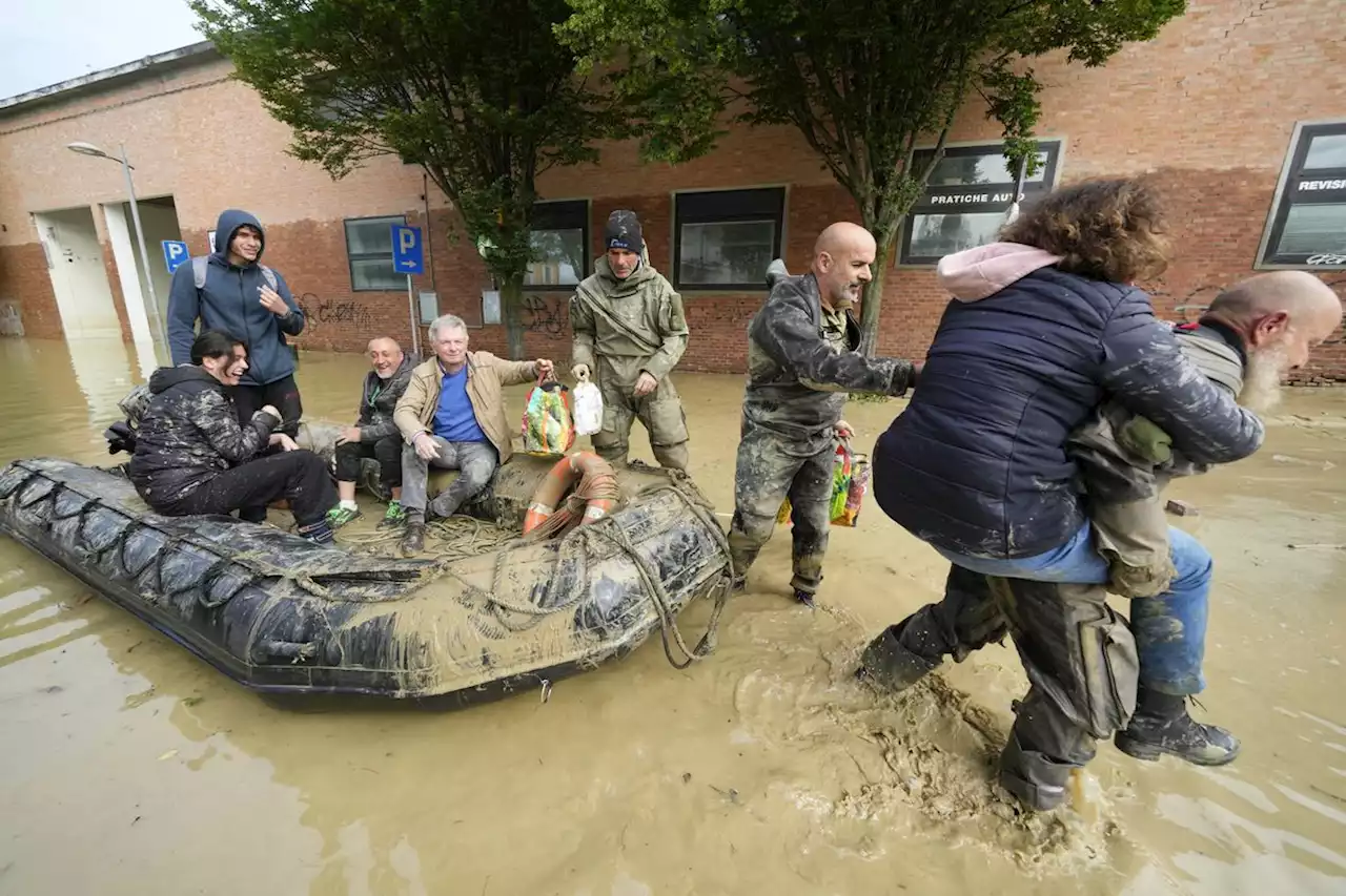 Crews work to reach Italian towns isolated by floods as toll rises to 13 and cleanup begins