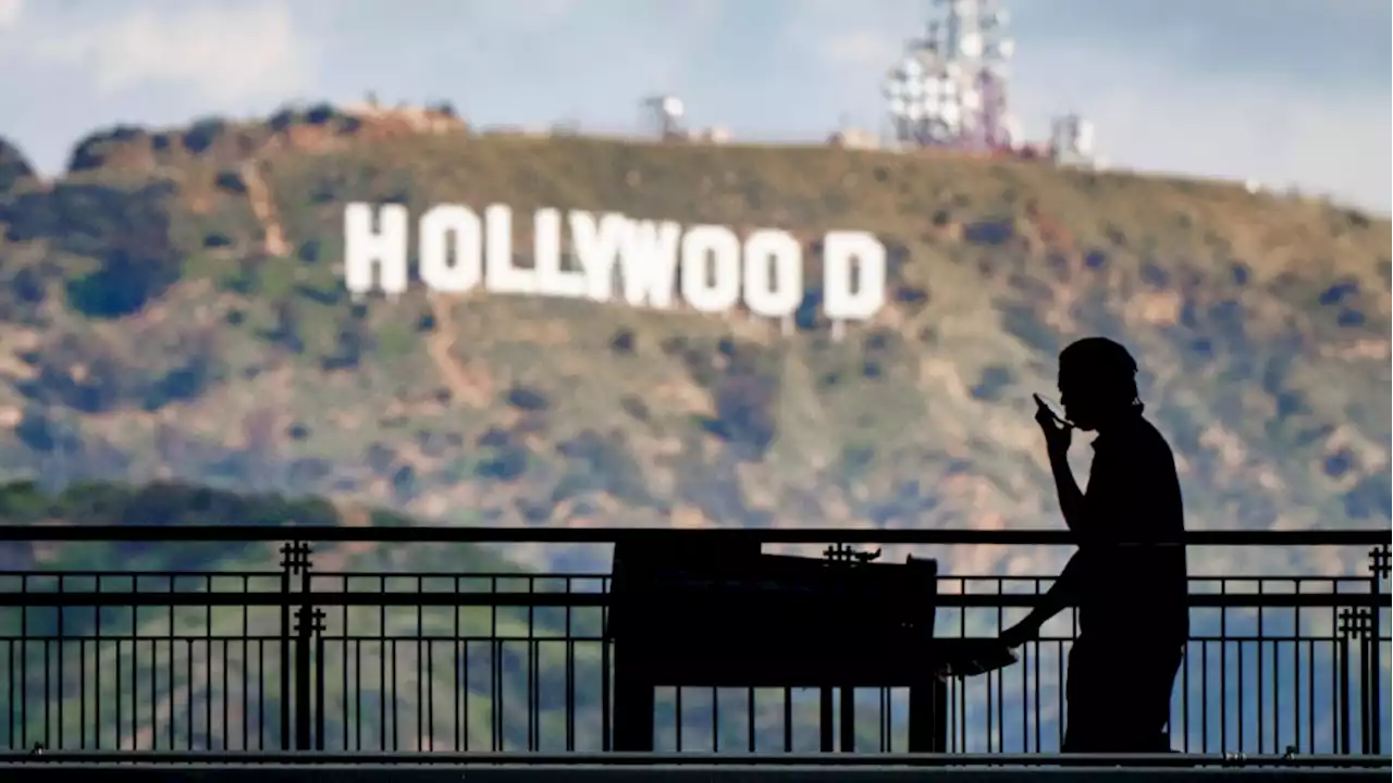 Hollywood writers, slamming 'gig economy,' to go on strike