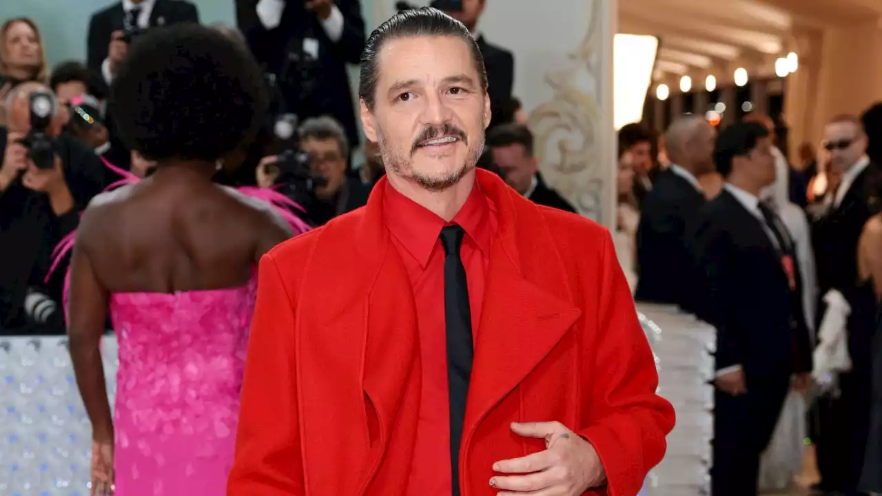 Pedro Pascal Rocks Red Trench Coat and Shorts at 2023 Met Gala