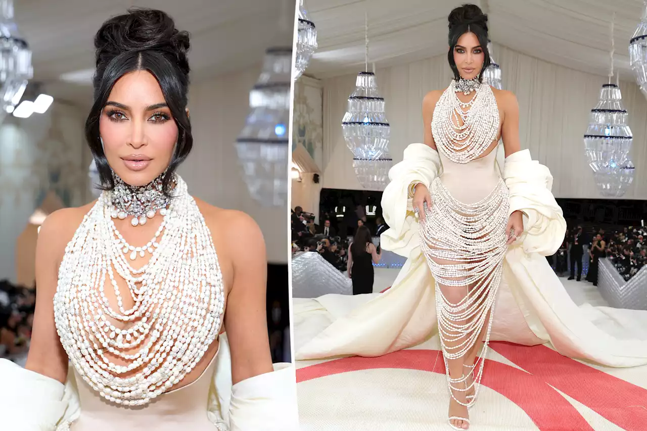 Kim Kardashian is draped in pearls and corset at Met Gala 2023