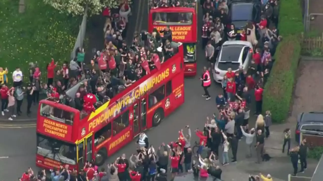 Ryan Reynolds and Rob McElhenney celebrate Wrexham AFC's promotion success with bus parade