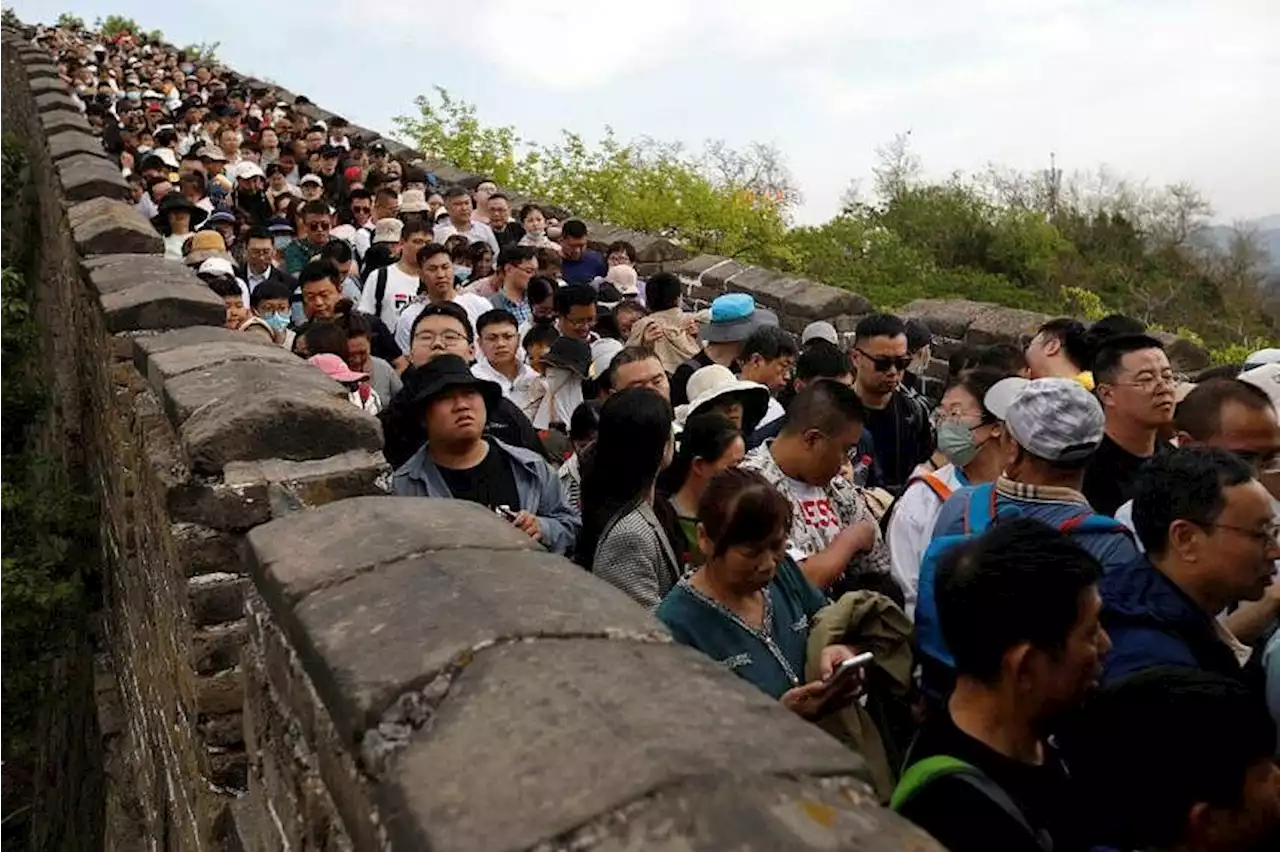 Tourists snoozing in loos as travel boom in China fuels mass crowds