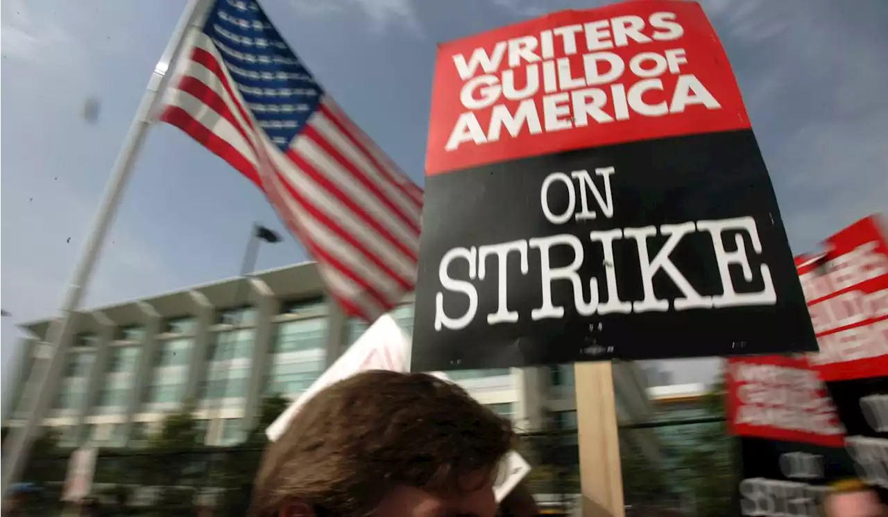 Hollywood writers, slamming ‘gig economy,’ go on strike