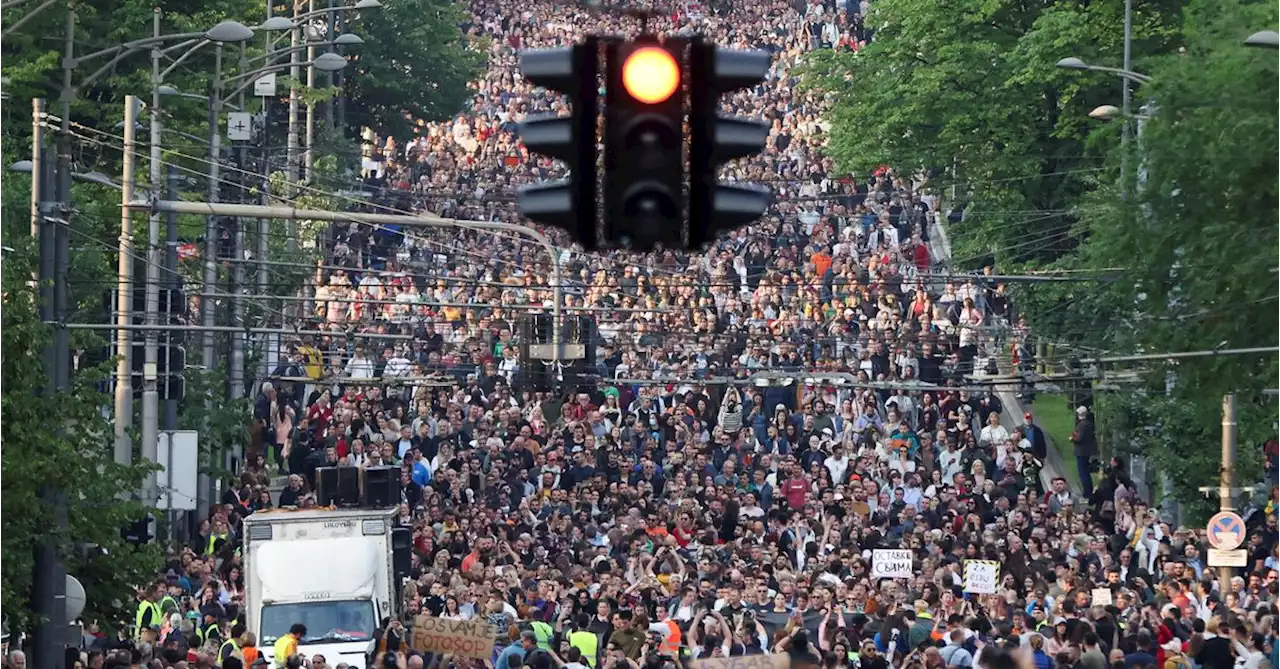 Tens of thousands gather in Belgrade protest over mass shootings