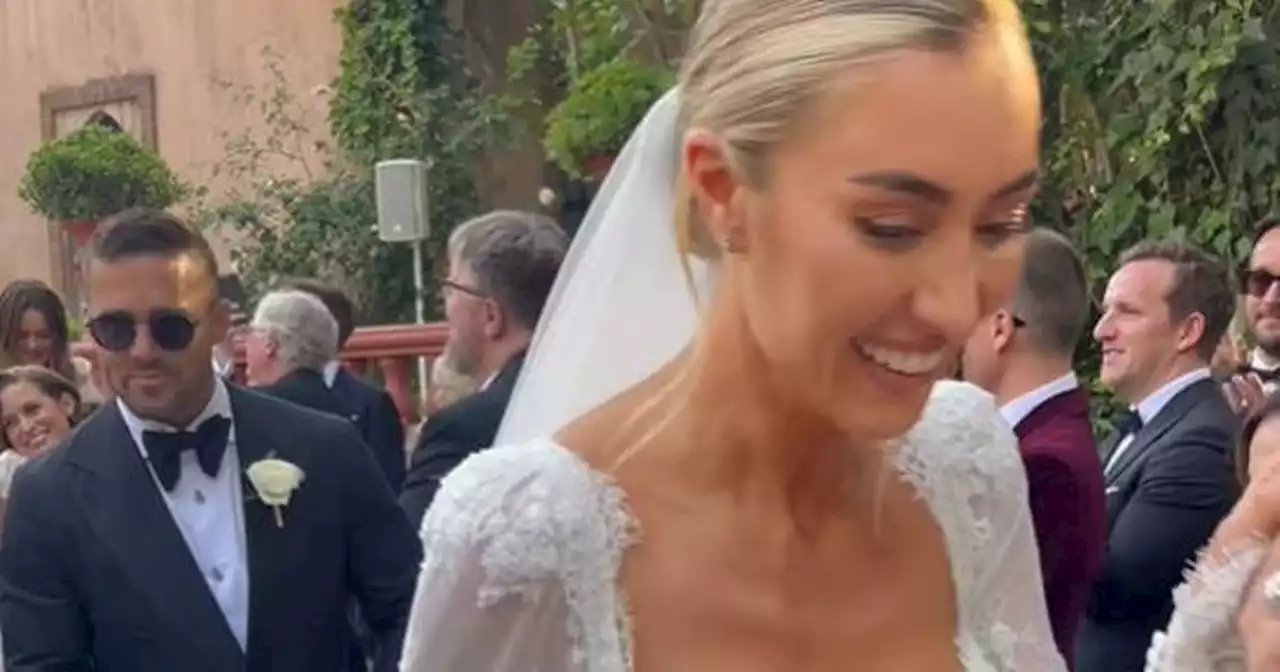 Spencer Matthews carries Sophie Habboo's veil at Spanish wedding after drama