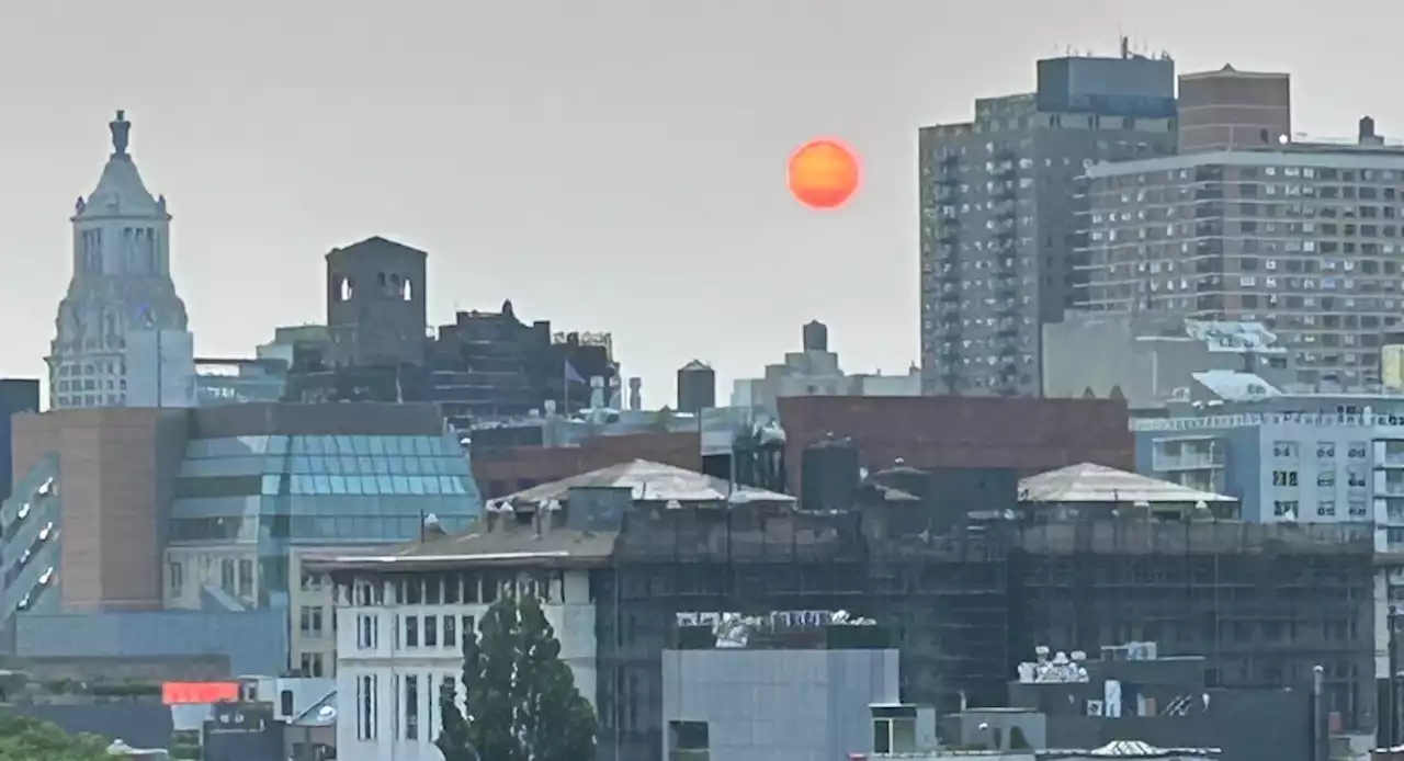 Canadian blazes give New York-area skies a fiery sunrise and smoky haze