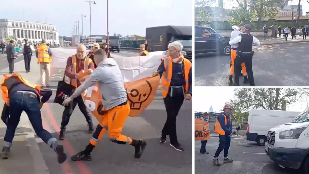 Furious builder tackled and handcuffed by police after he tries to shove Just Stop Oil protestors off the road