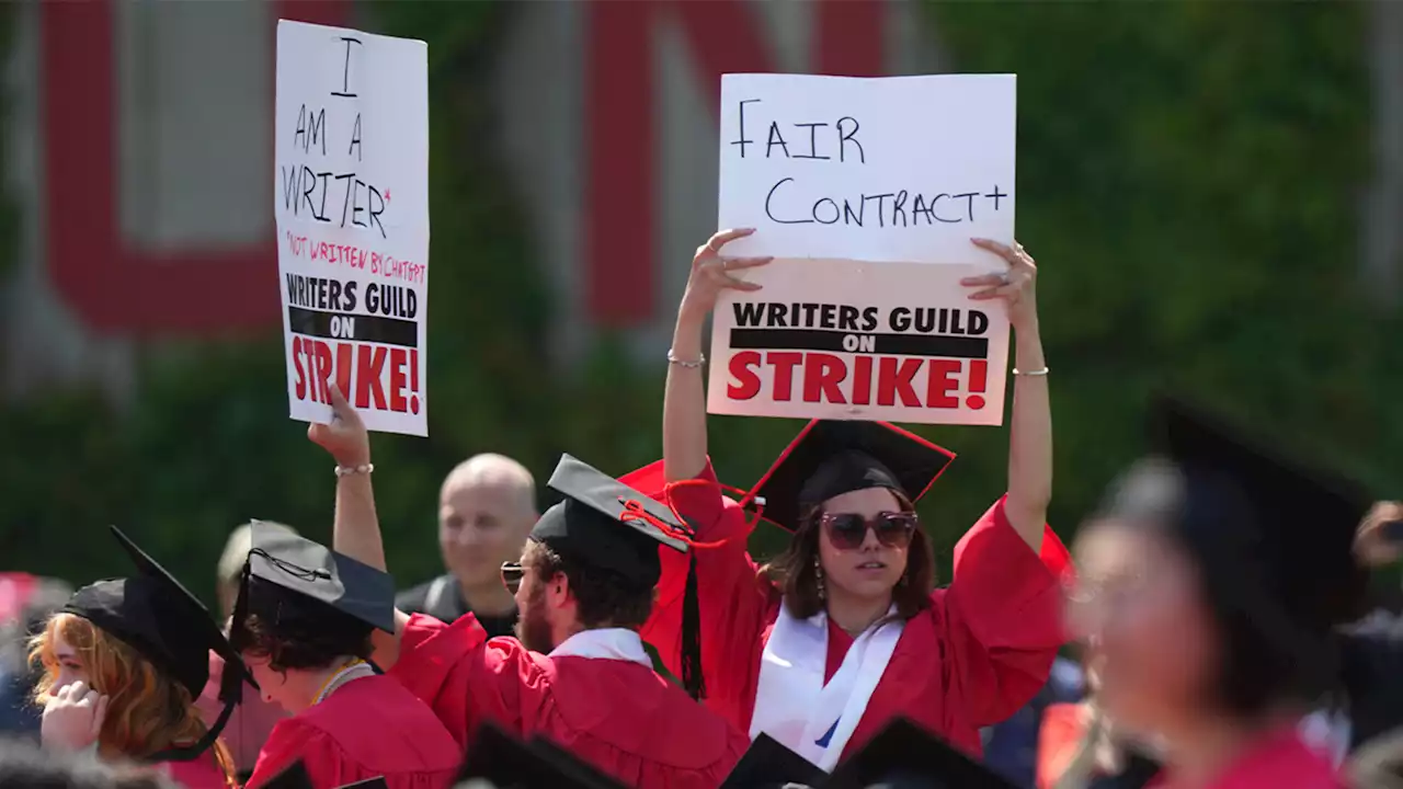 Scores of students boo, turn their backs on Warner CEO during BU graduation speech due to WGA strike