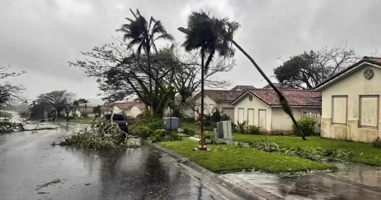 Typhoon warnings dropped for Guam as Mawar drifts away