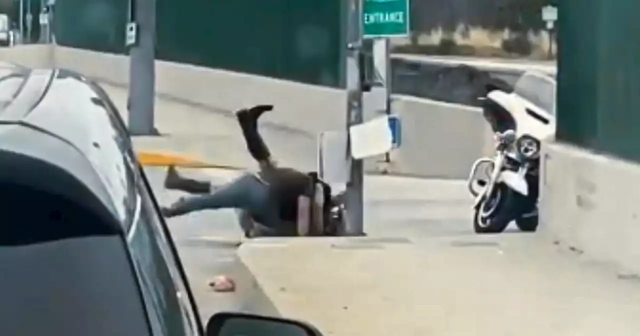 Motorist saw CHP officer pinned by man at 5 Freeway entrance. He rushed to save him