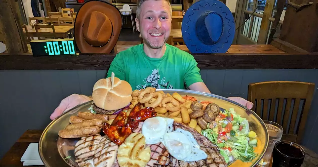 Man in agony after devouring 4,500 calories mixed grill challenge in 27 minutes