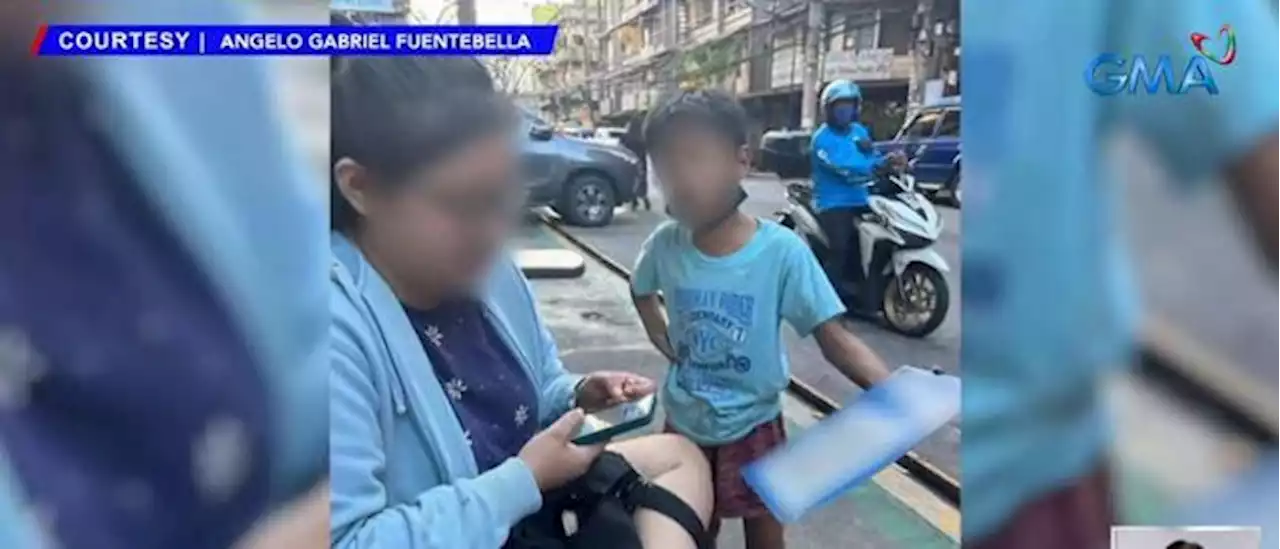 Manila street kids spotted begging using QR Code