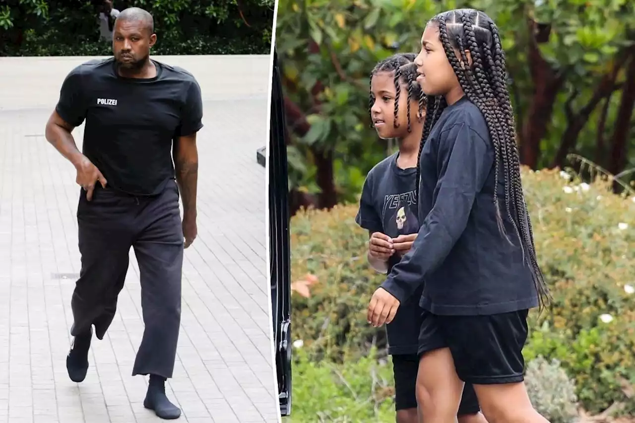 Kanye West wears extreme shoulder pads and sock shoes again during outing with kids