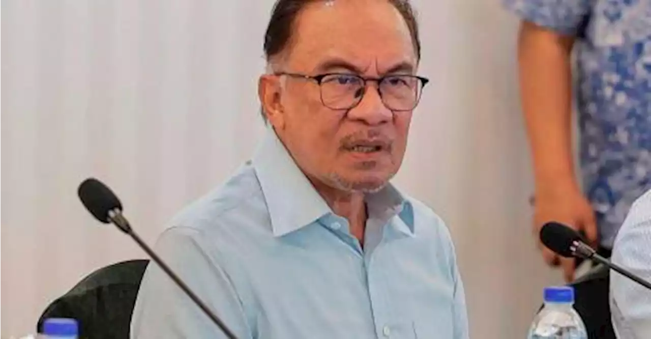 Anwar tells Muhyiddin to go ahead with legal action