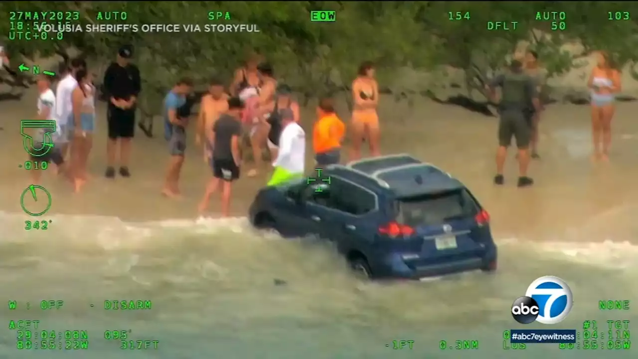 Driver arrested after plowing down Florida beach, narrowly missing families