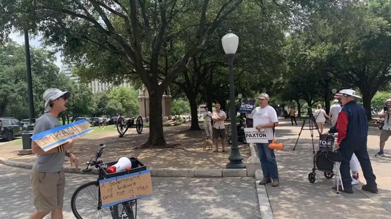 Few supporters, opponents of Paxton rally outside the Capitol