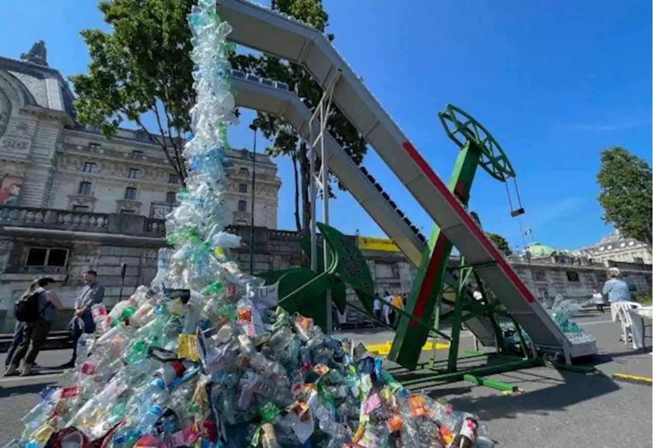 Plastic-spewing artwork unveiled for Paris talks against waste