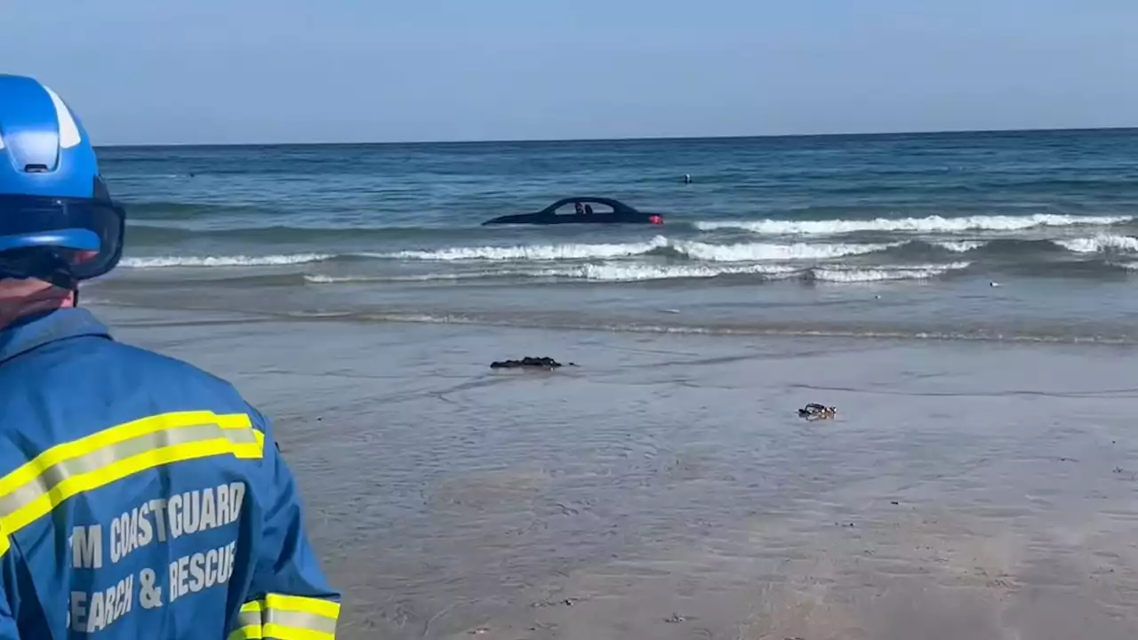 BMW washes out to sea after parking on Cornwall beach